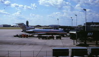 Minneapolis-st Paul Intl/wold-chamberlain Airport (MSP) - Note the old Braniff International gates (BI). The building in the distance, just in front of the AA 727's #2 engine inlet, was at one time (the 1950's or so) the airline terminal.  - by GatewayN727