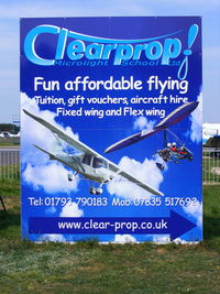 Blackbushe Airport, Camberley, England United Kingdom (EGLK) - sign in the carpark for the Clear-prop Microlight School - by Chris Hall