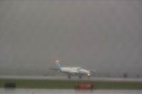 Billings Logan International Airport (BIL) - Alpine Air at Billings Logan in a rain storm. - by Daniel Ihde