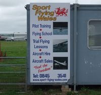 Pembrey Airport, Pembrey, Wales United Kingdom (EGFP) - Advert for flying school. - by Roger Winser