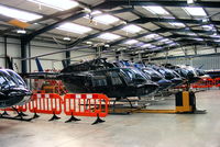Shobdon Aerodrome Airport, Leominster, England United Kingdom (EGBS) - lineup of Bell 206 Jetrangers in the Tiger Helicopter's hangar at Shobdon - by Chris Hall