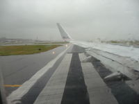 Ronald Reagan Washington National Airport (DCA) - Raining on the taxiway. - by Gary Barnes