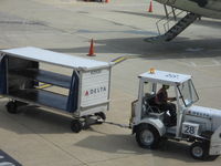 Ronald Reagan Washington National Airport (DCA) - Tug # 28 Delta baggage cart - by Ronald Barker