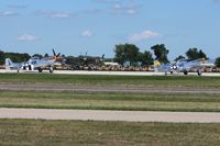 Wittman Regional Airport (OSH) - Warbirds lining up to depart RWY 18 at Airventure 2011. - by Bob Simmermon