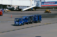 Ronald Reagan Washington National Airport (DCA) - Tug with # 18150 baggage carts on the ramp - by Ronald Barker