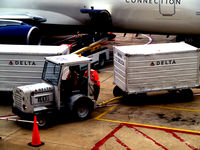 Ronald Reagan Washington National Airport (DCA) - Tug 40 with baggage cart in a congested Delta ramp - by Ronald Barker