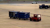Ronald Reagan Washington National Airport (DCA) - Red tug # 59045 with bags - by Ronald Barker