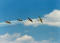 Quonset State Airport (OQU) - North American AT-6/SNJ's at Quonset State Airport, North Kingstown, RI - circa 1980's - by scotch-canadian