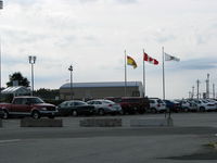 Saint John Airport, Saint John, New Brunswick Canada (CYSJ) - Flags flying near the main parking lot at the Saint John Airport - by Peter Pasieka
