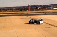 Ronald Reagan Washington National Airport (DCA) - Tug being towed by pickup truck - by Ronald Barker