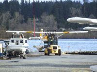 Kenmore Air Harbor Inc Seaplane Base (S60) - a Beaver is being beached and taxied by forklift at Kenmore Air Harbor - by Ingo Warnecke