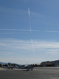 Santa Paula Airport (SZP) - Jet contrails past SZP Rwy 04-22; near-vertical is in unusual heading - by Doug Robertson