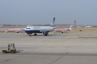 Chicago O'hare International Airport (ORD) - United Airlines Airbus A320 taxiing in on A4 with two American Eagle Embraer jets in the penalty box and a United Express  Embraer departing 32L in the background. - by Mark Kalfas