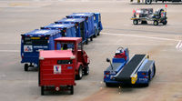 Dallas/fort Worth International Airport (DFW) - Baggage carts - by Ronald Barker
