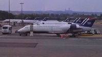 Ronald Reagan Washington National Airport (DCA) - US Express planes at the gate in the twilight - by Murat Tanyel