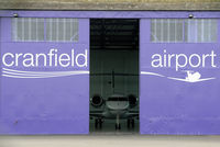 Cranfield Airport, Cranfield, England United Kingdom (EGTC) - New paintwork on a hangar at Cranfield Airport - by Paul Ashby