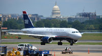 Ronald Reagan Washington National Airport (DCA) - US Airways Airbus taxing with the US Capitol in the background - by Ronald Barker
