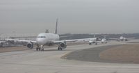 Charlotte/douglas International Airport (CLT) - Well it is January so it is a little hazy. However that was mainly from the Windows of my US Airways (Piedmont retro colors) A319 - Here is  a line up of planes waiting for us to take off - by Florida Metal