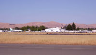 Buchanan Field Airport (CCR) - Tower and hangar area from the West side of the field at 6pm. - by Bill Larkins