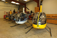 Wellesbourne Mountford Airfield Airport, Wellesbourne, England United Kingdom (EGBW) - R22's in the Heli Air hangar at Wellesbourne Mountford - by Chris Hall