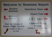 Swansea Airport, Swansea, Wales United Kingdom (EGFH) - Sign showing some of the operators based at Swansea Airport. - by Roger Winser