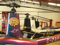 Wellesbourne Mountford Airfield Airport, Wellesbourne, England United Kingdom (EGBW) - R22's in the Heli Air hangar at Wellesbourne Mountford - by Chris Hall