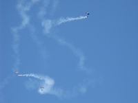 Camarillo Airport (CMA) - Three parachutists doing stunts with smoke opening the Wings Over Camarillo Airshow 2013. - by Doug Robertson