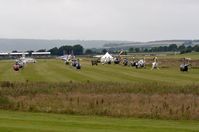 Goodwood Airfield Airport, Chichester, England United Kingdom (EGHR) - Helicopter parking during 2013 Goodwood Revival at Chichester Goodwood Airport, UK - by FerryPNL