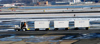 Ronald Reagan Washington National Airport (DCA) - Delta baggage carts - Tug 63 - National - by Ronald Barker
