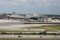 Miami International Airport (MIA) - Afternoon at Terminal J shows more variety with a mix of Avianca/Taca, Alitalia, Lufthansa, Caribbean as well as LAN - by Florida Metal