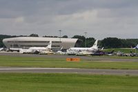 Farnborough Airfield - Line up including HB-ZUV - by John Coates