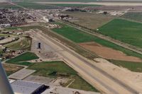 Chowchilla Airport (2O6) - As it looked in 1994. View is north.Most activity is Ag operations. Highway 99 is seen on the far right. - by S B J