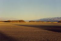 Furnace Creek Airport (L06) - View from the tiedown area toward the  runway and to the NW. Visibility is often unlimited.Frist time flying into D V,pilots will be amused to see the altimeter go below zero by some 200 feet and a 600 ft pattern (altimeter) is in order. - by S B J