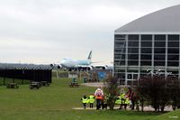 Manchester Airport, Manchester, England United Kingdom (EGCC) - A view of the Runways Restaurant and Concorde hangar at Manchester Airport EGCC viewing area, highlighting its close proximity to the aircraft, in this case a B747-867F Cargo plane of Cathay Pacific. - by Clive Pattle