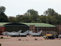 RAF Leuchars Airport, Leuchars, Scotland United Kingdom (EGQL) - Busy apron at RAF Leuchars with three Typhoons from the based 6 Sqn and a 100 Sqn Hawk sharing the space. In the background is a good view of one of the original WWII hangars. - by Clive Pattle