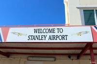 SFAL Airport - Welcome to Stanley Airport sign on the airport terminal building - by Clive Pattle