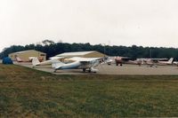 Clarion County Airport (AXQ) - N3368E & N89364- A bad weather stop at Clarion,Pa. with several (5) other planes doing the same. They were returning (flying east) from the Oshkosh Flyin in 1989.The red C150 (is 150 hp) was exported to Portugal in 2006. - by S B J