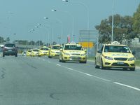 Melbourne International Airport, Tullamarine, Victoria Australia (YMML) - An endless stream of taxis coming from the holding area to the terminal at YMML 20141128 - by red750