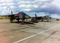 RAF Lossiemouth Airport, Lossiemouth, Scotland United Kingdom (EGQS) - 16 (R) Sqn ramp at RAF Lossiemouth EGQS in October 1995 showing two of the Sqn's Sepecat Jaguar T.2's awaiting their next training sortie. - by Clive Pattle