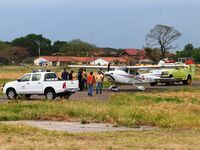 El Trompillo Airport, Santa Cruz Bolivia (SLET) - DGAC authorities checking on CP-2836 that suffered a flat tire - by confauna