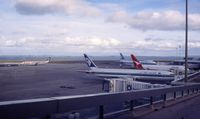 Auckland International Airport, Auckland New Zealand (AKL) - Nice shot of the apron at Auckland: Arrow's good old DC8, a B767-300 and a B747-200 in Air NZ's old livery, and a Qantas B767-200 - by Micha Lueck