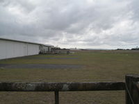 Kerikeri/Bay of Islands Airport, Kerikeri / Bay of Islands New Zealand (NZKK) - View of local hangar and terminal outdoor area. This airfield is most common first or last stop for light aircraft being imported or exported by air from new Zealand. - by magnaman