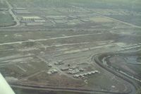 Q59 Airport - Fremont airport,Calif. soon after its 1986 closure.Due to the short closure notice and removal of planes and hangars,there were some  angry owners. An X on a runway, I have seen to many in my time. View is east. - by S B J