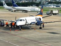 Buenos Aires Airport - A SAAB 340 of SOL airlines in front and a Boeing 737 of Austral without the engines in the back  - by confauna