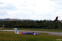 Edinburgh Airport, Edinburgh, Scotland United Kingdom (EGPH) - The airfield swallows a Flybe Dash 8 at Edinburgh EGPH - by Clive Pattle