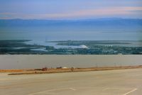 San Carlos Airport (SQL) - Top picture is view to the east and the main reporting point when flying in from that direction, which is the cement plant . I reported over it many times.This pic also shows the amazing Howard Hughes Mining Barge I which was there in the mid 80s. - by S B J