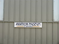 Santa Paula Airport (SZP) - Main Hangar Sign of Aviation Museum of Santa Paula, on closed bi-fold doors. - by Doug Robertson