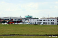 Cranfield Airport - The tower and other airport buildings at Cranfield EGTC, Bedfordshire, UK viewed from the runway - by Clive Pattle