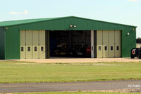 Leicester Airport, Leicester, England United Kingdom (EGBG) - A hangar at Leicester EGBG containing helicopters - by Clive Pattle
