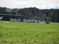 Ardmore Airport, Auckland New Zealand (NZAR) - a few flying club Cessna parked by tower due to a filming session on their normal apron - by magnaman